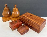 Pear shaped wooden bookends with box and three other boxes next to them