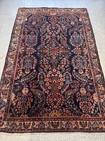 Full view of rug laid flat showing overall design and condition