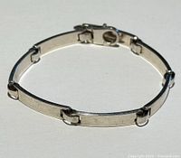Italian 925 silver bracelet, fully clasped showing flat rectangular links and secure clasp.