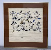 Full view of the framed Inuit art print showing eight figures in traditional clothing arranged dynamically.