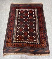 Full view of the vintage handwoven kilim rug showing the overall pattern and color scheme.