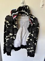 Front view of camo BAPE shark hoodie unzipped