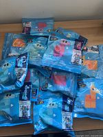 Stack of twelve sealed Mega Bloks polybags