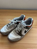 Top view of both sneakers showing laces, colourway and general wear