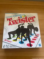 Front of Twister boxed game showing artwork, branding and age rating
