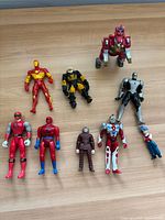 All nine figures laid out on table