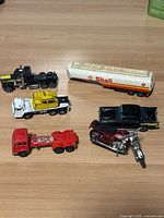 Group view of all six die-cast vehicles