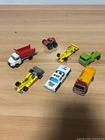 group shot of all eight die-cast vehicles