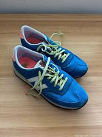 Top view of both sneakers showing color, laces, logos