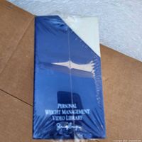 Blue VHS case sealed in shrink wrap with title 'Personal Weight Management Video Library Jenny Craig'