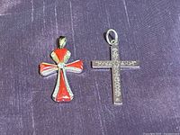 Front view of both sterling cross pendants
