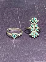 Both sterling silver turquoise rings side by side