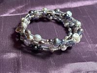 Full view of coiled multicolor pearl bracelet