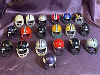 Full set of 19 mini Riddell NFL helmets in four staggered rows