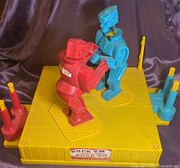 Full game set showing base, robots, control handles