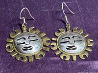 Front view of both sun earrings showing design and metals