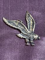 Front view of sterling silver eagle pendant