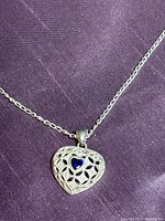 Close view of pendant detailing and stone