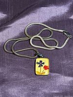 Full view of snake chain necklace with pendant attached