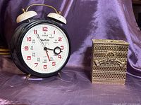 Clock and tissue box side by side on display