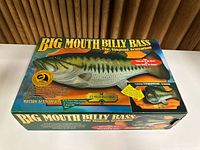 Front of original retail box for Big Mouth Billy Bass animatronic fish showing product image and features.