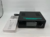 Front and top view of Fosgate Audionics preamp/processor unit with visible serial number label.