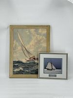 Both the large sailboat painting and smaller sailboat photograph displayed together, showing relative size and framing