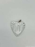 Clear heart-shaped Waterford crystal pendant with silver bail showing front view.