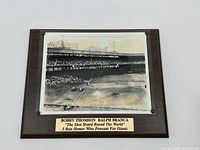 Framed photo with plaque of Bobby Thomson's historic home run, titled 'The Shot Heard Round The World'