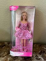 Front view of Barbie doll in original packaging with 'With Love' print and Target special edition sticker.