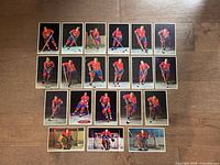 All nineteen postcard-size cards laid out on floor