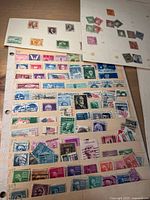 Album pages with numerous U.S. and international stamps