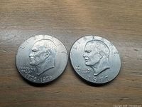 Obverse of both Eisenhower dollars showing 1776-1976 and 1977 dates