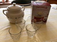 Group shot of cookie jar, four glasses, boxed ice cream maker
