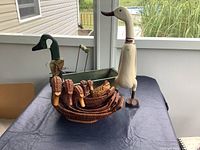 Overall lot showing baskets, tote with duck head, standing goose