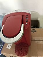 Angled top view showing silver handle, control buttons, overall condition