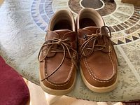 Top view of pair of brown leather L.L.Bean boat shoes