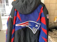 Back view of Patriots color-blocked hooded jacket