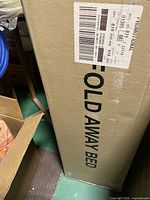 Shipping box side labelled FOLD AWAY BED