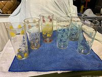 All six tumblers grouped on towel