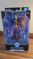 Front of sealed DC Multiverse The Joker figure box showing figure and accessories
