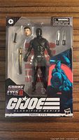 Front of sealed Snake Eyes #16 Classified Series box showing figure and accessories