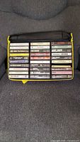 Front view of open cassette carrier showing all tapes