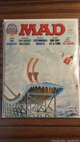 Front cover of MAD Magazine Feb 1977 No.195 in plastic sleeve