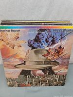 Stack of records, top album Weather Report Heavy Weather visible