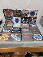 All 20 Def Leppard CDs displayed on table