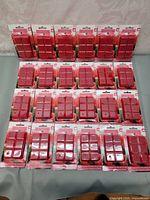 Front view showing 24 Raspberry Sorbet wax melt packs arranged in rows