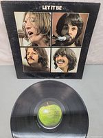 Front cover showing Beatles portrait layout with record displayed