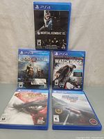 All five PS4 game cases laid out