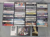 Wide shot showing all cassette rows and three CDs